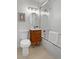 Bright bathroom with modern vanity, stylish mirror, and tiled shower/tub combo at 9639 W 63Rd Pl, Arvada, CO 80004