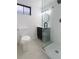 Modern bathroom featuring glass shower, updated vanity and fixtures, and a toilet at 9639 W 63Rd Pl, Arvada, CO 80004