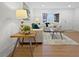 Inviting living room with wood floors, neutral furniture, a bay window, and stylish décor, perfect for relaxation and entertaining at 9639 W 63Rd Pl, Arvada, CO 80004
