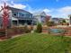 Landscaped backyard view of the lawn and wood fence with a hammock, perfect for outdoor enjoyment at 821 Boulder Peak Ave, Erie, CO 80516