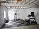 Finished basement featuring gym equipment and padded flooring provides space for workouts at 821 Boulder Peak Ave, Erie, CO 80516