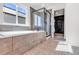 Luxurious bathroom features a soaking tub, shower with glass door, and patterned tile floor at 821 Boulder Peak Ave, Erie, CO 80516