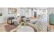 Bright living room boasts modern decor, hardwood floors, and comfortable seating, creating a cozy atmosphere at 821 Boulder Peak Ave, Erie, CO 80516
