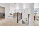 Open loft at the top of the stairs offers ample natural light, carpeting, and access to bedrooms at 821 Boulder Peak Ave, Erie, CO 80516