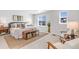 Bright primary bedroom features large windows, neutral color palette, and stylish decor at 821 Boulder Peak Ave, Erie, CO 80516