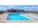 Stunning view of a community pool surrounded by modern architecture with ample lounging space at 821 Boulder Peak Ave, Erie, CO 80516