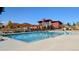 Community swimming pool offering lounge seating and ample space for recreation on a sunny day at 821 Boulder Peak Ave, Erie, CO 80516