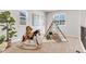Bright room featuring a cute play tent and rocking horse at 821 Boulder Peak Ave, Erie, CO 80516