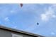 Ballooning view of blue skies featuring a pair of hot air balloons at 821 Boulder Peak Ave, Erie, CO 80516