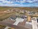 Expansive aerial view showcasing the home's exterior, surroundings, long driveway, large lot, and neighboring properties at 9915 E 162Nd Pl, Brighton, CO 80602