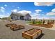 Landscaped backyard with garden beds, offering a serene outdoor space at 9915 E 162Nd Pl, Brighton, CO 80602