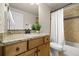 Bathroom featuring granite countertop vanity, shower with curtain, and modern toilet at 9915 E 162Nd Pl, Brighton, CO 80602