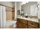 Stylish bathroom featuring tile accents, granite counters, and modern fixtures at 9915 E 162Nd Pl, Brighton, CO 80602