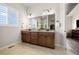 Elegant bathroom featuring a double vanity, granite countertops, and stylish fixtures at 9915 E 162Nd Pl, Brighton, CO 80602