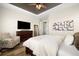 Bright bedroom with a large dresser, cozy chair, and comfortable bedding for a restful retreat at 9915 E 162Nd Pl, Brighton, CO 80602