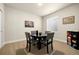 Cozy dining area with a round table, four chairs, and natural light at 9915 E 162Nd Pl, Brighton, CO 80602