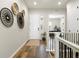 Inviting entryway with wood flooring, white trim, and decorative wall hangings at 9915 E 162Nd Pl, Brighton, CO 80602