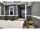 Charming front entrance with stone accents and a cozy seating area at 9915 E 162Nd Pl, Brighton, CO 80602