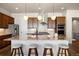 Beautiful kitchen island featuring granite countertops, pendant lighting, and seating for four at 9915 E 162Nd Pl, Brighton, CO 80602
