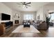 Inviting living room with a fireplace and ample seating, perfect for gatherings or quiet relaxation at 9915 E 162Nd Pl, Brighton, CO 80602