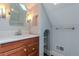 This cozy bathroom boasts a modern sink, vanity, and stylish light fixtures at 132 Delaware St, Denver, CO 80223