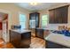 Well-equipped kitchen with stainless steel appliances, dark cabinets, and efficient layout at 132 Delaware St, Denver, CO 80223