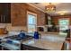 This is a kitchen with granite countertops, stainless steel appliances, and exposed brick at 132 Delaware St, Denver, CO 80223