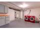 Spacious laundry room with washer, dryer, storage cabinets, and ample floor space at 132 Delaware St, Denver, CO 80223