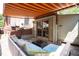 This inviting patio features comfortable seating under a striped awning, perfect for outdoor relaxation at 132 Delaware St, Denver, CO 80223