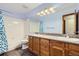 Neutral toned bathroom has double sinks with updated fixtures at 10963 Bryant St, Westminster, CO 80234