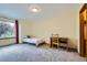 Bedroom featuring a large window and neutral carpeting at 10963 Bryant St, Westminster, CO 80234