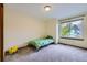 Bright bedroom featuring a large window at 10963 Bryant St, Westminster, CO 80234