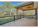 Relaxing covered deck featuring a wooden ceiling, ceiling fan, and comfortable bench seating, perfect for outdoor entertaining at 10963 Bryant St, Westminster, CO 80234