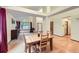 Dining room area featuring hardwood floors, a wooden table, and a large window at 10963 Bryant St, Westminster, CO 80234
