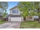 Charming two-story home featuring a well-manicured lawn, two car garage and inviting curb appeal at 10963 Bryant St, Westminster, CO 80234