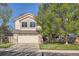 Charming two-story home with a two-car garage, front yard, and mature trees at 10963 Bryant St, Westminster, CO 80234