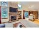 Bright living room boasts a brick fireplace and sliding doors to the deck at 10963 Bryant St, Westminster, CO 80234