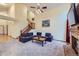 Inviting living room with vaulted ceiling, plush carpet, and cozy seating area at 10963 Bryant St, Westminster, CO 80234