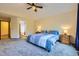 The spacious main bedroom provides an ensuite bathroom and neutral carpeting at 10963 Bryant St, Westminster, CO 80234