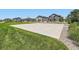 Community basketball court surrounded by grass and nearby neighborhood homes at 11902 Norfolk Ct, Commerce City, CO 80022