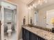 Well-lit bathroom with granite countertop and a shower/tub combo at 11902 Norfolk Ct, Commerce City, CO 80022