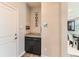 Inviting entryway with storage cabinet featuring granite counters at 11902 Norfolk Ct, Commerce City, CO 80022