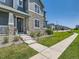 Charming two-story home with stone facade and manicured lawn at 11902 Norfolk Ct, Commerce City, CO 80022