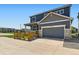 Two-story home featuring a porch, fenced yard, and a two car garage at 11902 Norfolk Ct, Commerce City, CO 80022