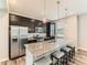Well-lit kitchen boasts stainless steel appliances, an island with a countertop, and pendant lighting at 11902 Norfolk Ct, Commerce City, CO 80022