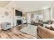 Cozy living room with a fireplace, lots of natural light, and comfortable seating arrangements at 11902 Norfolk Ct, Commerce City, CO 80022