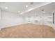 Finished basement with custom built-in shelves, neutral carpet, and recessed lighting at 443 Garfield St, Denver, CO 80206