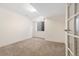 Cozy basement bedroom, providing natural light, neutral carpet, and glass paneled doors at 443 Garfield St, Denver, CO 80206