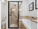 Updated bathroom with glass enclosed shower and separate soaking tub at 443 Garfield St, Denver, CO 80206
