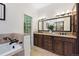 Elegant Primary bathroom with double vanity, granite countertop and walk in shower at 443 Garfield St, Denver, CO 80206